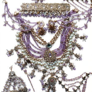 Lavender Kundan bridal jewellery set on white background – choker, layered necklace, earrings and maang tikka
