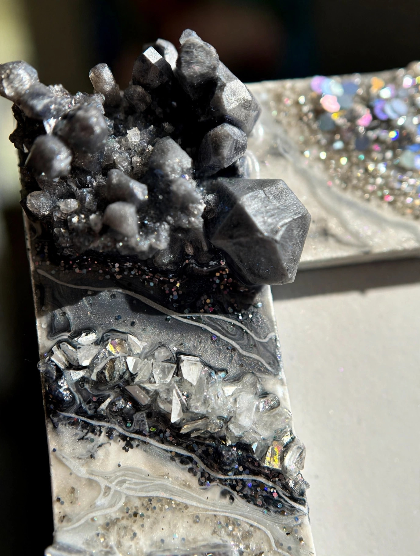 Close-up of crystal clusters on geode resin frame