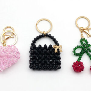 Set of 3 handmade beaded bag charms on white background