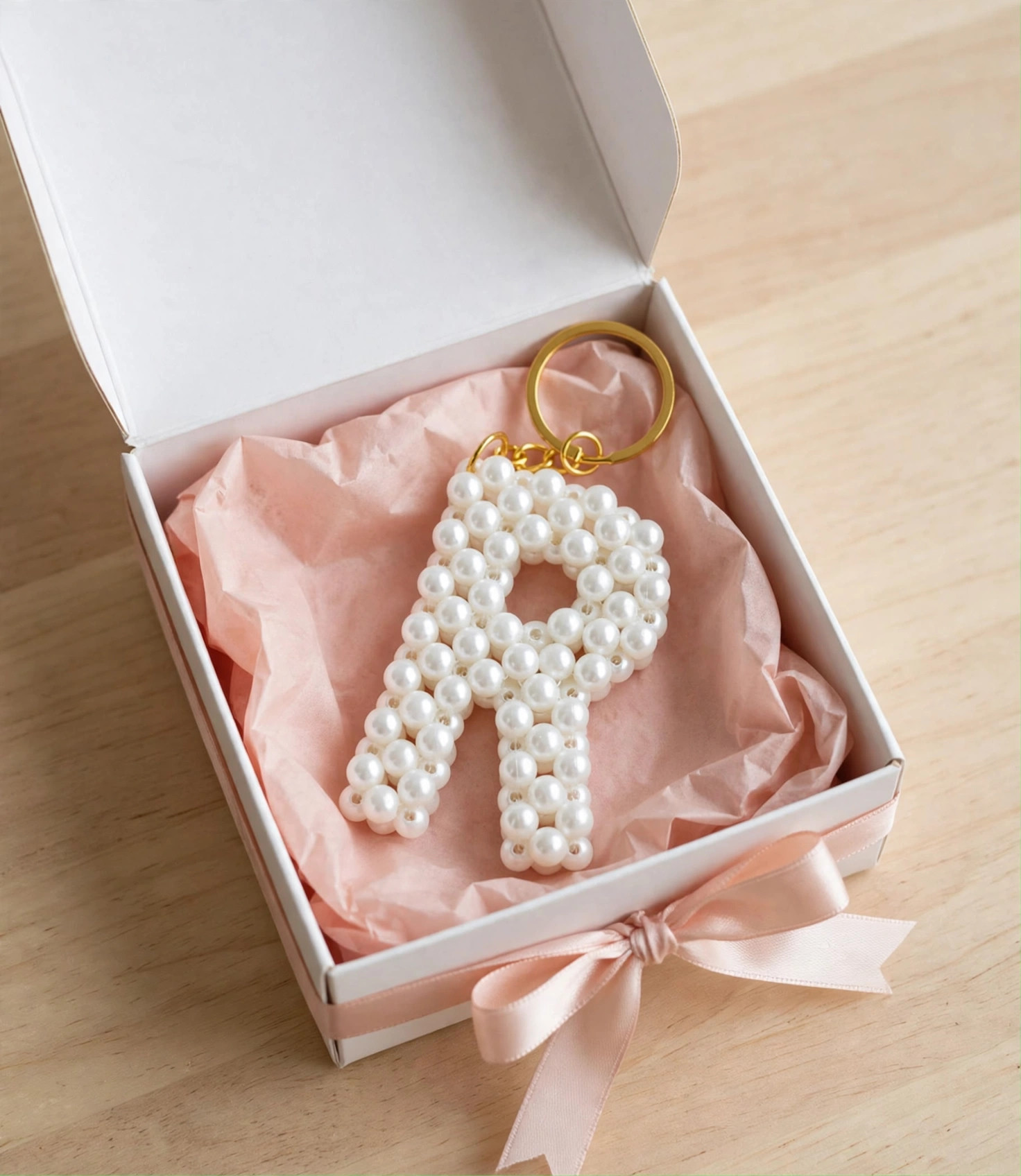 Pearl initial keychain in gift box with ribbon