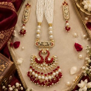 Red meenakari pearl mala necklace with Kundan pendant and matching earrings