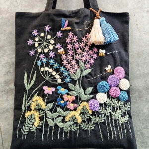 Hand-embroidered black floral garden tote — main product image