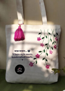 Hand-Embroidered White Canvas Tote Bag – Pink Floral Vine with Tassel