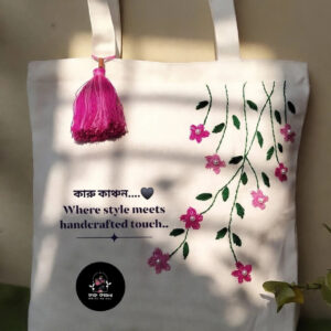 Hand-embroidered white tote, pink floral vine — main product image
